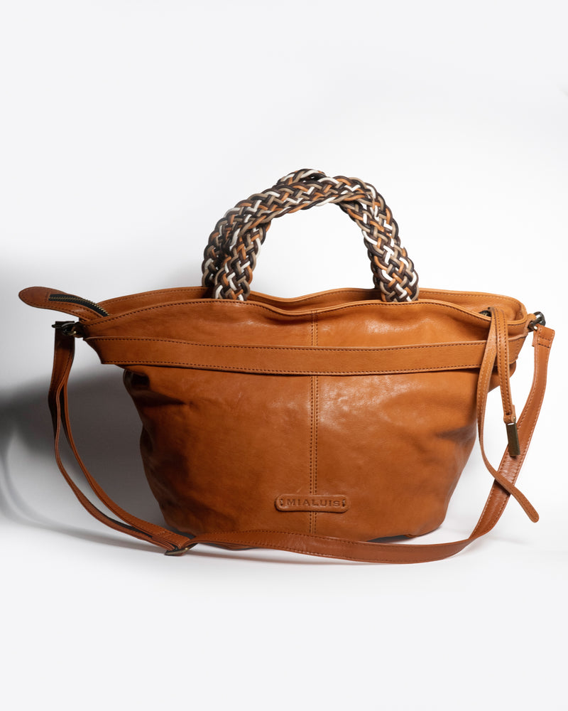Biscuit Nappa leather handbag with braided handle on a white background