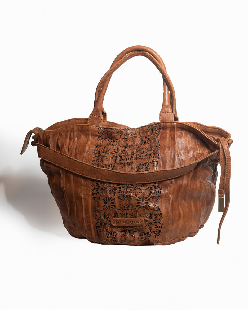 Cognac Nappa  leather handbag with embossed pattern on a white background