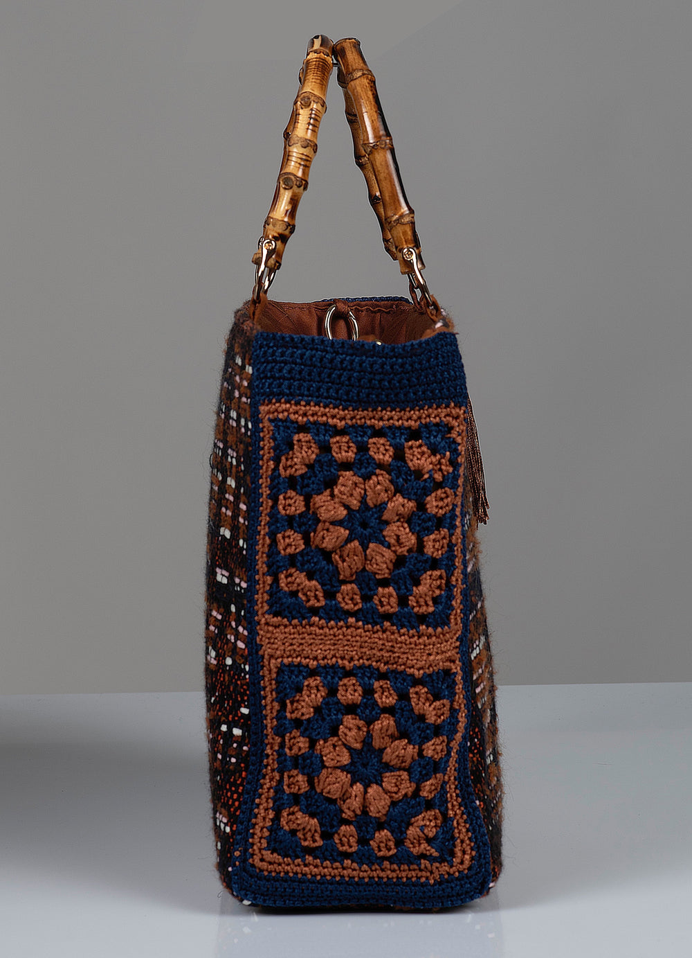 Crocheted flower handbag with bamboo handle.  