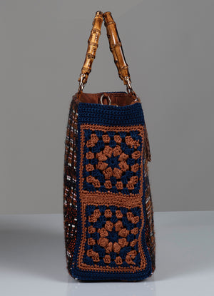 Crocheted flower handbag with bamboo handle.  