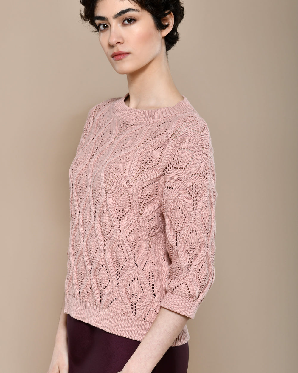 Cotton knit sweater in powder pink with three quarter sleeves.  Made in Italy. 