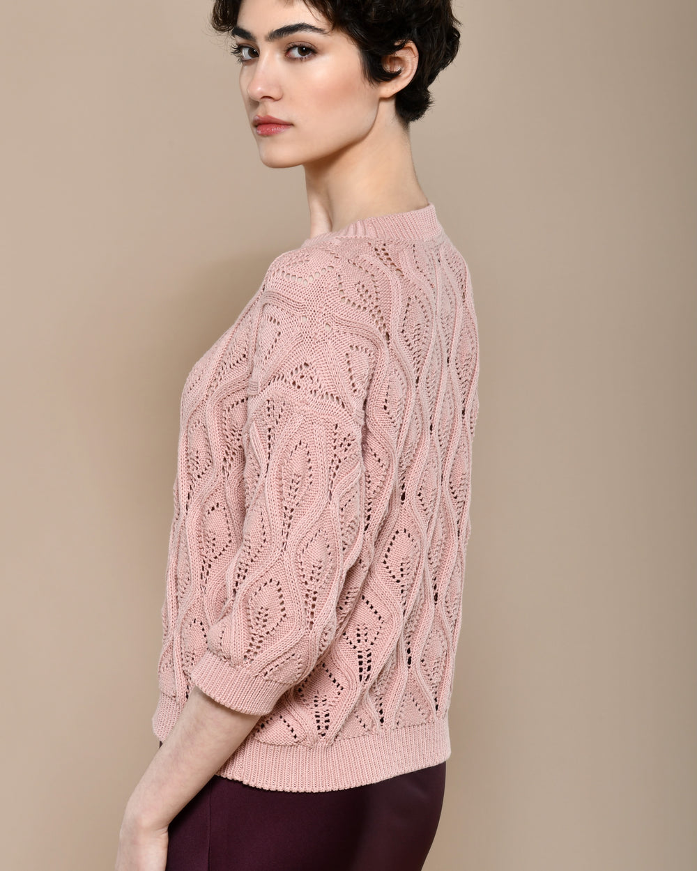 Cotton knit sweater in powder pink with three quarter sleeves.  Made in Italy. 